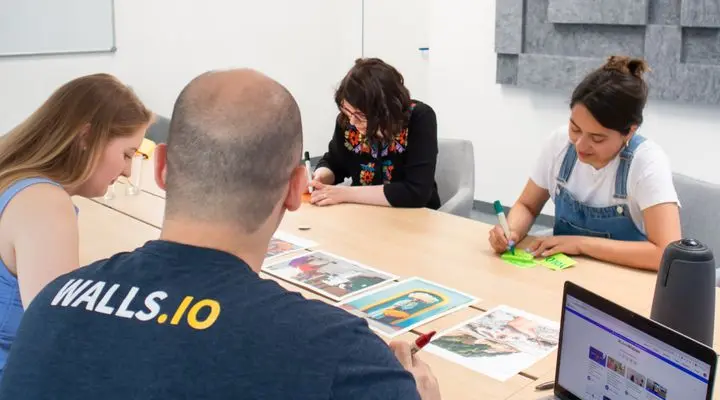 Marketing team reviewing a product listing plan